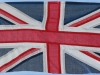 The Union Flag flown correctly. The wide white band next to the pole, is uppermost