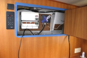 The sat compass and AIS are installed behind the pilot house bookcase