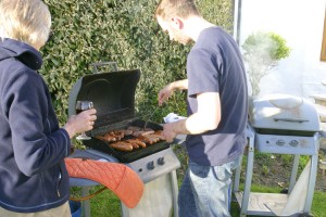 Our eldest son sizzles the sausages for a BBQ