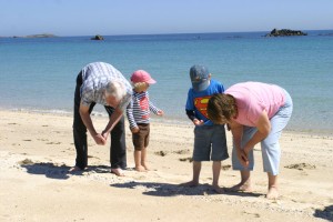Grandparents and two grandchildren hunt for Cowries