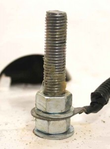The new bolt, greased up to prevent corrosion recurring