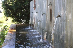 Water taps and corrugated iron made a novel water features