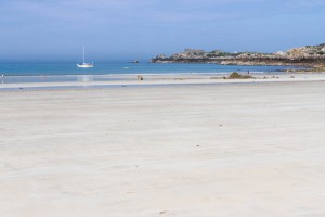 Low tide shows off acres of sandy beach at L'Ancresse Bay