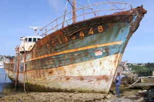 The graveyard for old wooden fishing boats is next to the marina