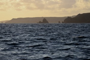In pre-dawn twilight, cliffs and rocks look daunting